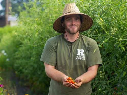 Andrew holds up cherry tomatoes